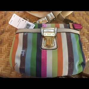 Sassy striped swingpack/ crossbody purse by Coach